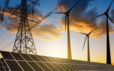 Solar panels with wind turbines and electricity pylon at sunset. Clean energy concept.
